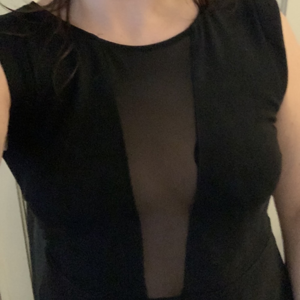 Classic A-line black dress with a deep-plunge front and mesh back